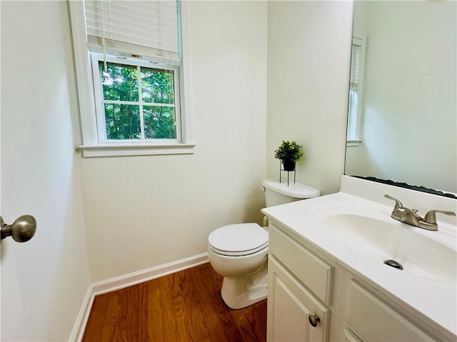 365 Friars Head Dr, Suwanee, GA 30024 - bathroom featuring wood finished floors, vanity, toilet, and baseboards