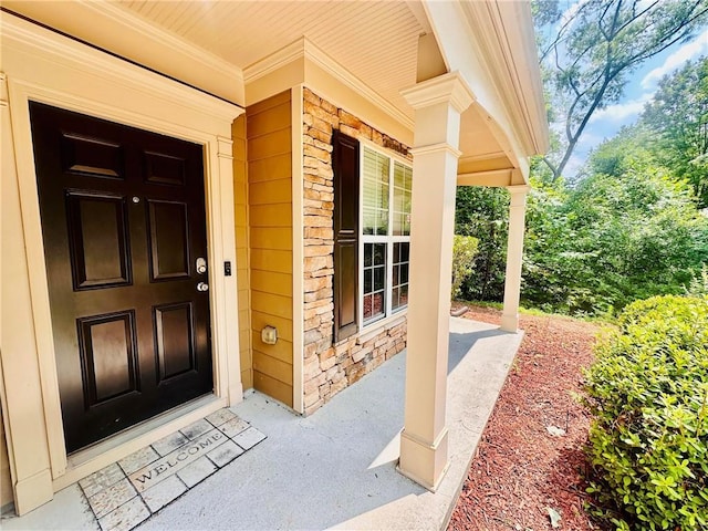 365 Friars Head Dr, Suwanee, GA 30024 - entrance to property with a porch and stone siding
