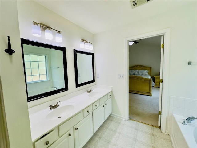 365 Friars Head Dr, Suwanee, GA 30024 - full bath with double vanity, a bath, connected bathroom, baseboards, and tile patterned floors