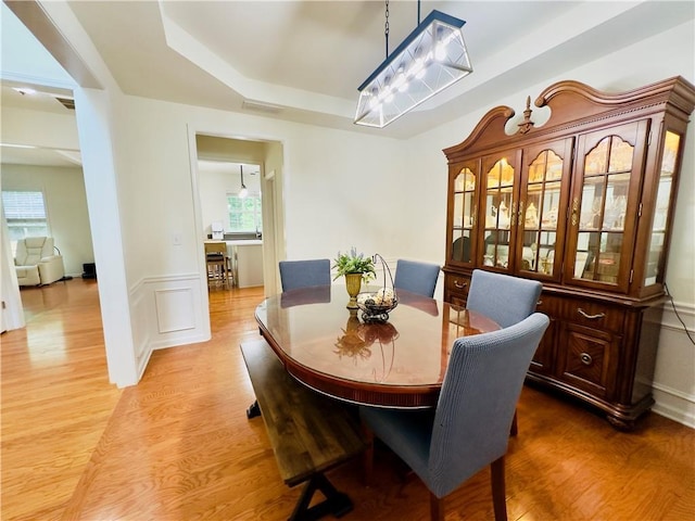 365 Friars Head Dr, Suwanee, GA 30024 - dining space with light wood-style flooring and a raised ceiling