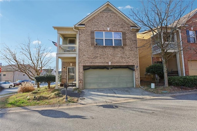 view of front of house featuring driveway, brick siding, an attached garage, and a balcony