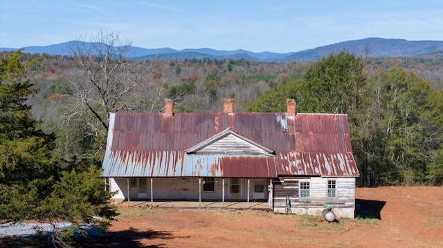 birds eye view of property featuring a mountain view