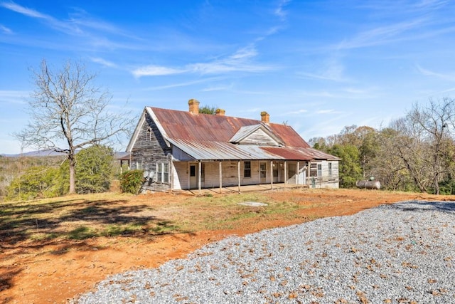 back of house featuring covered porch