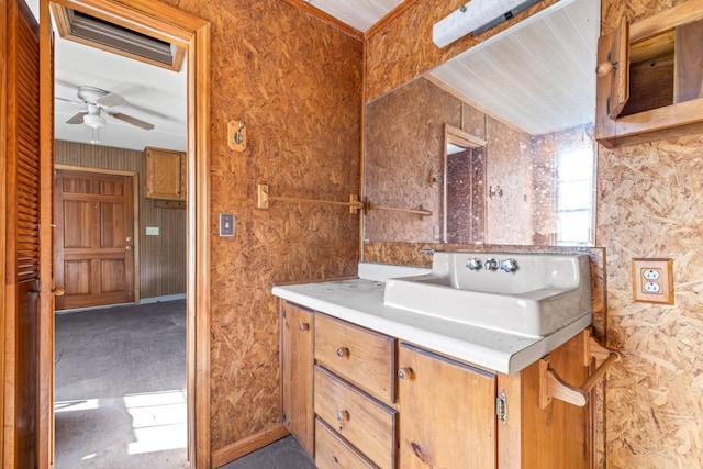 bathroom with ceiling fan and vanity