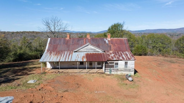 birds eye view of property featuring a mountain view