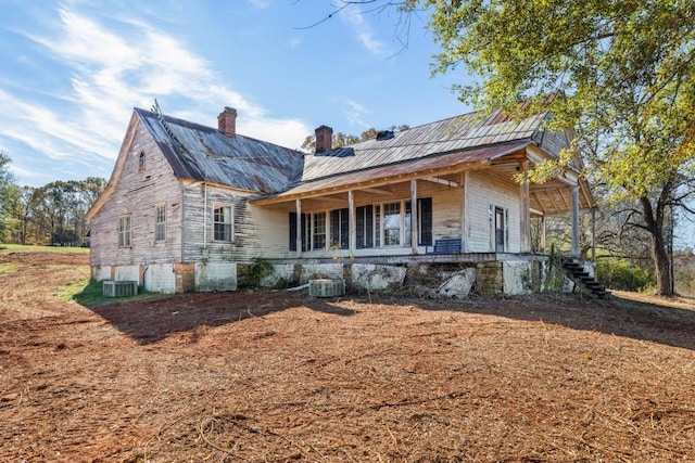 view of front of home featuring covered porch and central AC unit