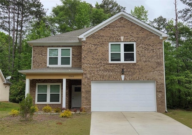 view of front of property with concrete driveway, brick siding, and an attached garage