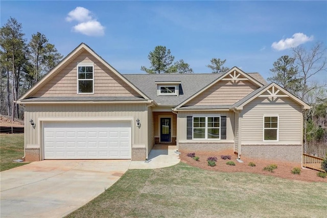 craftsman inspired home with a garage and a front yard