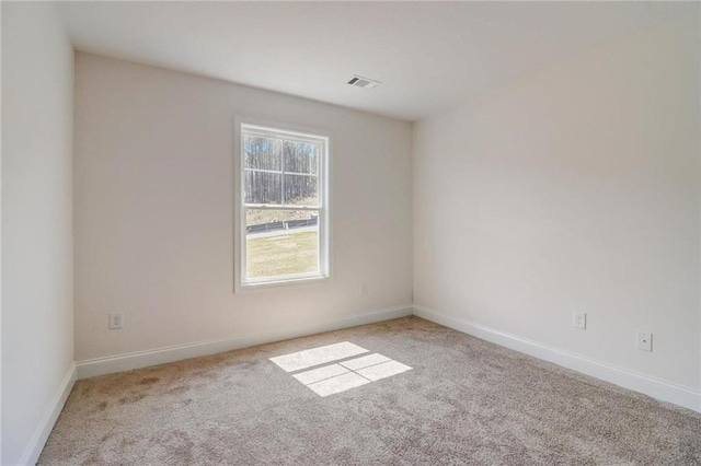 unfurnished room with light carpet