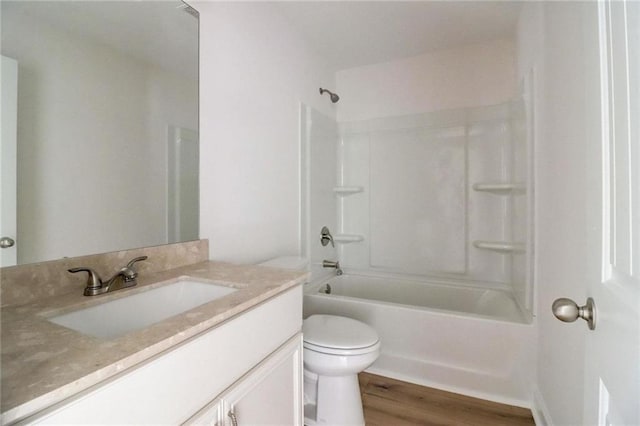 full bathroom with vanity, toilet, tub / shower combination, and wood-type flooring