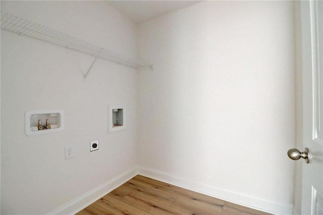 washroom with hardwood / wood-style floors, hookup for a washing machine, and hookup for an electric dryer