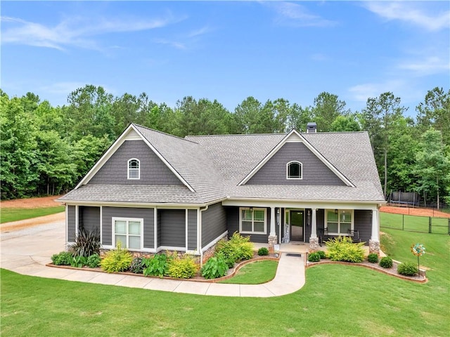 view of front of property featuring a front lawn and covered porch