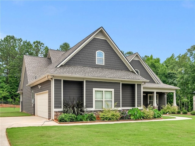 craftsman-style home featuring a garage and a front yard