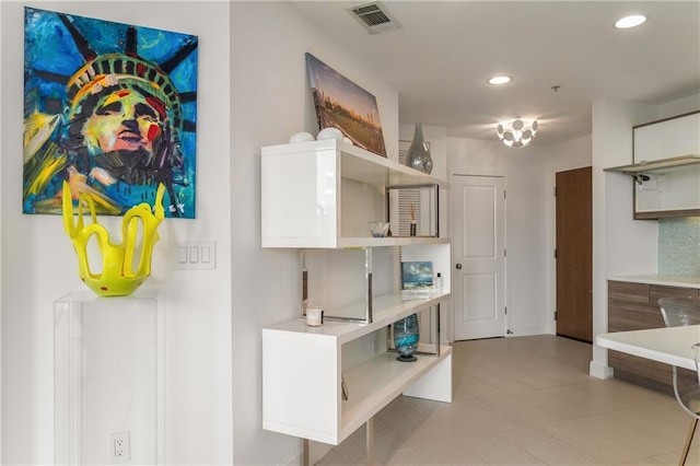 kitchen featuring white cabinets and decorative backsplash