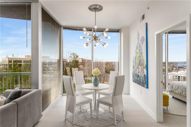 sunroom featuring a notable chandelier