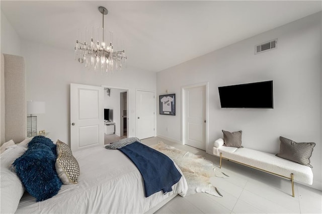 bedroom featuring a notable chandelier