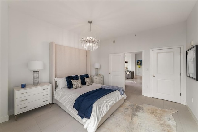 bedroom with a notable chandelier