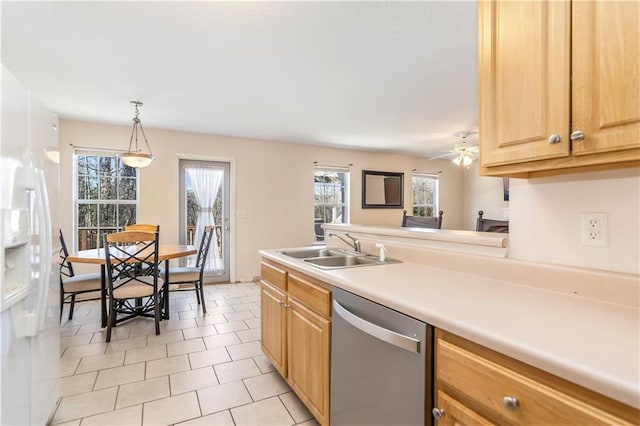 kitchen featuring dishwasher, sink, ceiling fan, light tile patterned floors, and decorative light fixtures