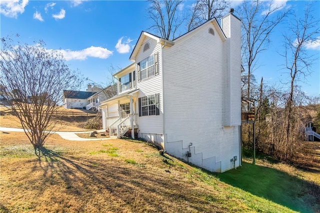 view of property exterior featuring a yard