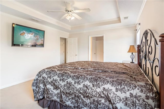 bedroom with a raised ceiling, ceiling fan, and ornamental molding