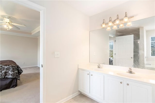 bathroom with walk in shower, ceiling fan, vanity, and ornamental molding