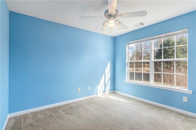 carpeted empty room with ceiling fan