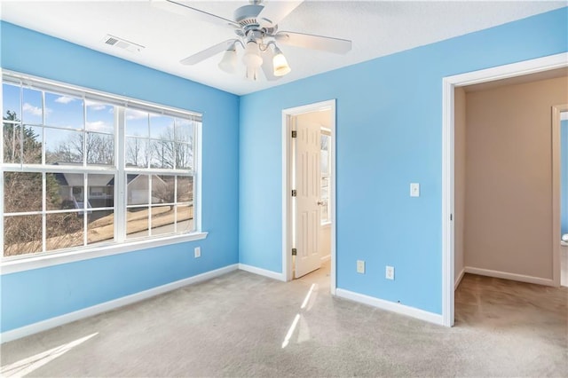 unfurnished bedroom featuring carpet floors and ceiling fan