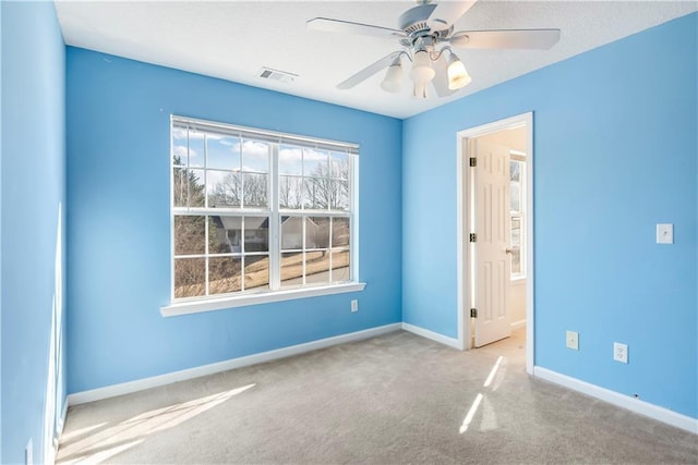 carpeted empty room with ceiling fan