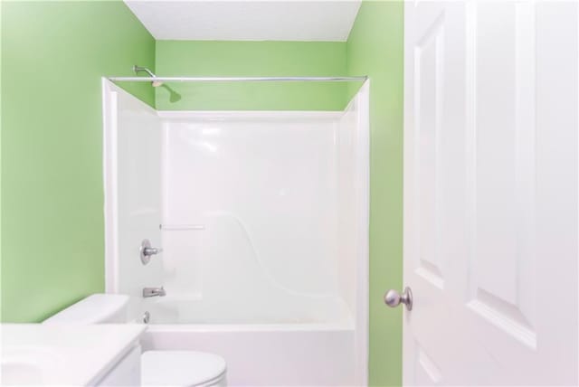 full bathroom featuring vanity, tub / shower combination, and toilet