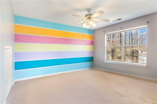 empty room featuring ceiling fan