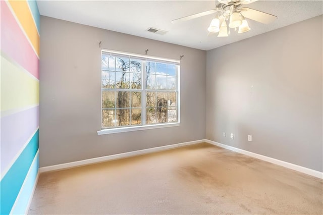 empty room with carpet and ceiling fan