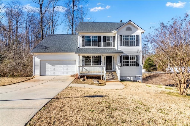 view of property featuring a porch and a garage