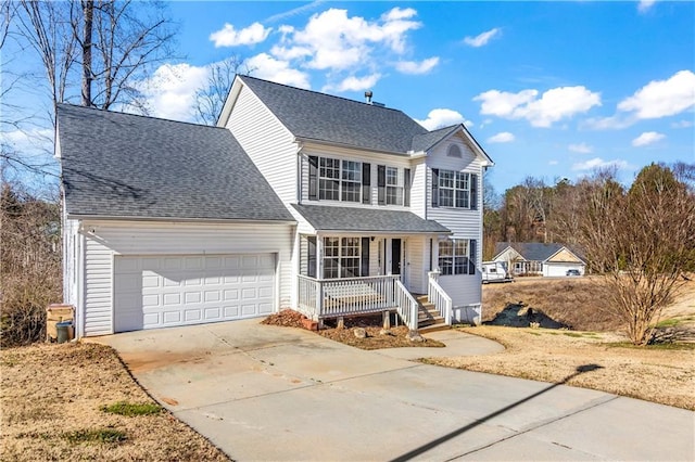 view of property featuring a porch and a garage