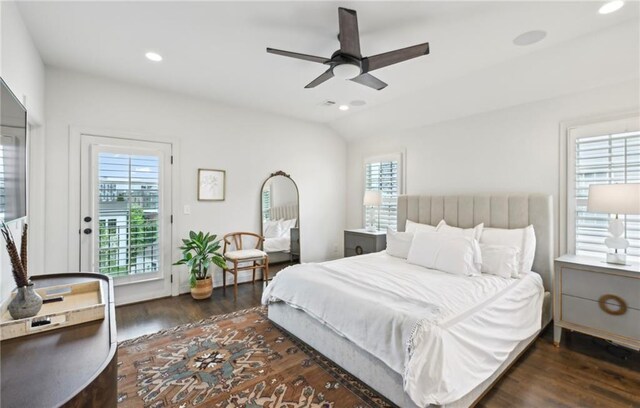 bedroom with multiple windows, recessed lighting, wood finished floors, and access to exterior