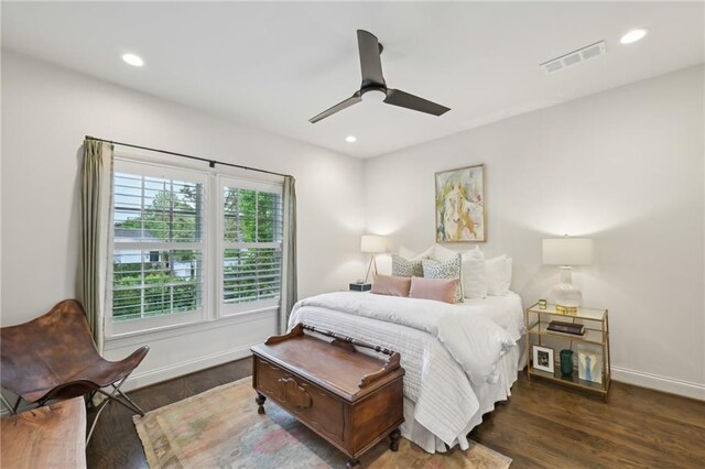 bedroom featuring baseboards, recessed lighting, wood finished floors, and visible vents