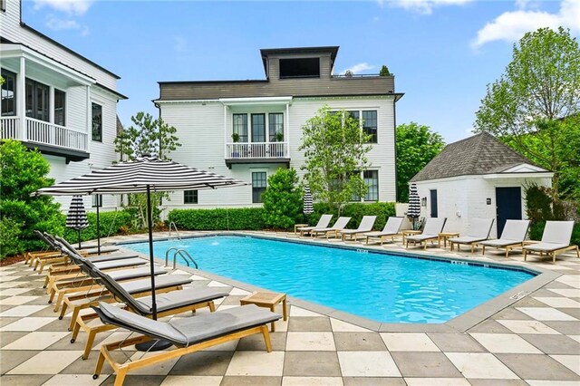community pool with a patio area