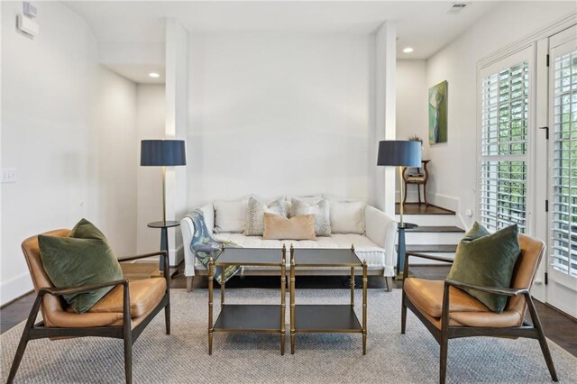 living area featuring recessed lighting, baseboards, and a healthy amount of sunlight