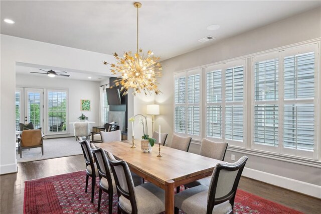 dining area with recessed lighting, visible vents, wood finished floors, and ceiling fan with notable chandelier
