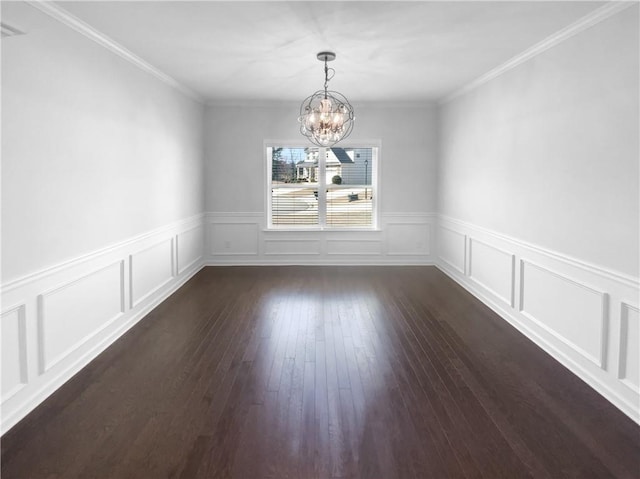 unfurnished dining area featuring an inviting chandelier, dark wood-style floors, a decorative wall, and crown molding