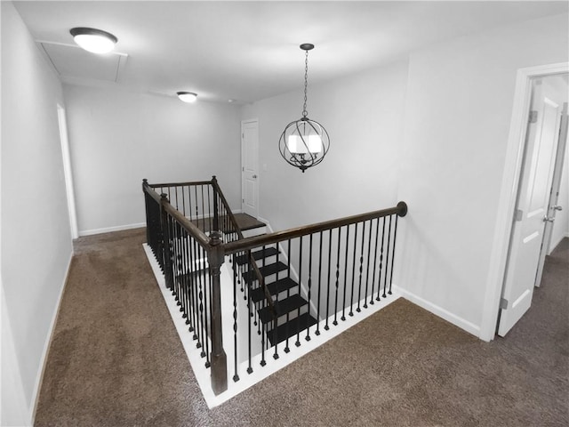 stairway featuring carpet flooring and baseboards