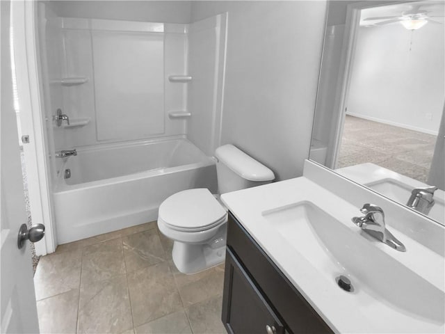 bathroom with toilet,  shower combination, and vanity