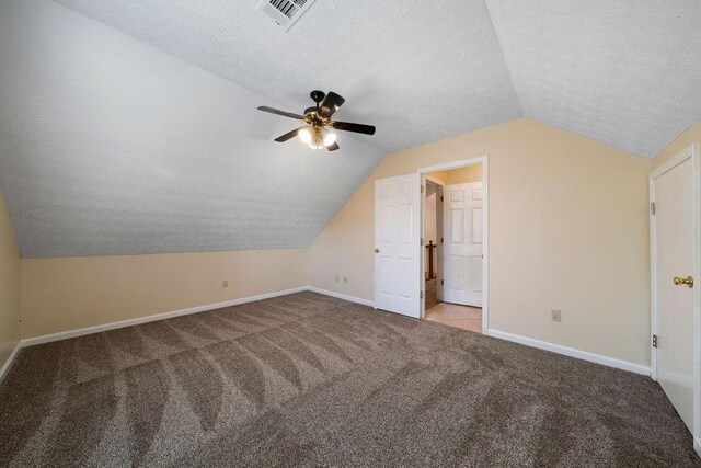 120 Paces Lakes Pt, Dallas, GA 30157 - additional living space with a textured ceiling, carpet floors, baseboards, vaulted ceiling, and a ceiling fan