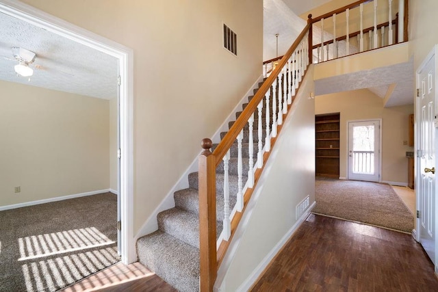 120 Paces Lakes Pt, Dallas, GA 30157 - stairway with baseboards, carpet flooring, wood finished floors, a high ceiling, and a ceiling fan