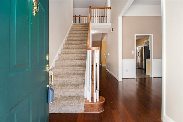 foyer entrance featuring dark wood-type flooring