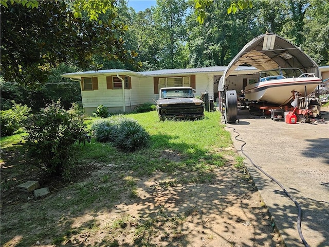 view of front of home with a carport