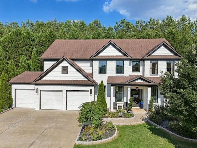 view of front of house featuring a porch and a garage