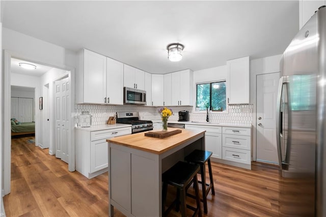 kitchen featuring appliances with stainless steel finishes and white cabinetry