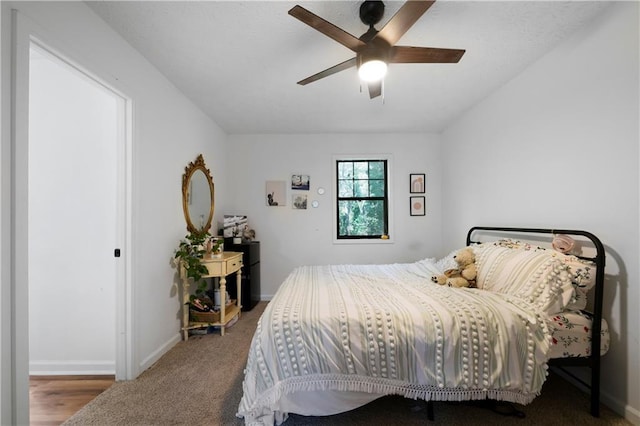 bedroom with ceiling fan and carpet flooring