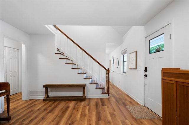 entrance foyer with hardwood / wood-style floors