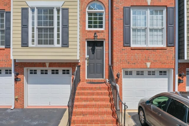 view of exterior entry featuring a garage